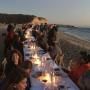 Long table, pretty beach, happy people ...