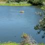 A family in a raft float on the calm waters. Non-motorized watercraft are welcome on Antonelli Pond.