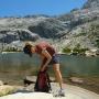 Rummaging in the day pack for bear bait at Twin Lakes. Photo courtesy Brooke Wright.