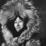 Fur was fine in 1915, but we're glad there are sleeker options for the modern woman who chooses to brave the elements. Library of Congress photo.