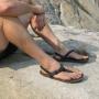 Thin neoprene soles + adjustable nylon or leather straps = a back-to-nature experience for your feet, minus the abrasions, stickers and stepping in gross stuff.