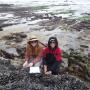 Monica and her research assistant Courtenay are seen here kneeling on a mussel bed. Photo courtesy Monica Moritsch