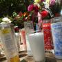 Votive candles beseech the Virgin of Pinto Lake.