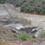 Heavy machinery rearranges the confluence of the Carmel River and San Clemente Creek on Aug. 7, 2015.