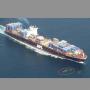 A container ship passes close to a whale. NOAA photo.