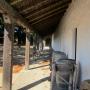 Old household implements under the adobe's walkway. Hilltromper photo.