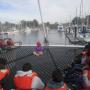 Celia Lara of O'Neill Sea Odyssey gives the students an orientation on the O'Neill Catamaran's mesh deck.