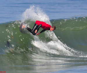 Skimboarder on 26th Avenue surf break in Santa Cruz. Photo credit: Mark Grissom.
