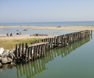 Aptos Creek meets the Pacific Ocean at Rio Del Mar, sometimes creating a summertime lagoon. Photo by Garrett McAuliffe.