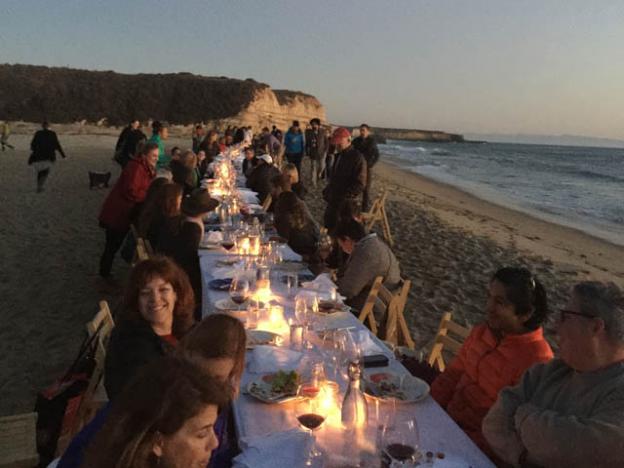 Long table, pretty beach, happy people ...
