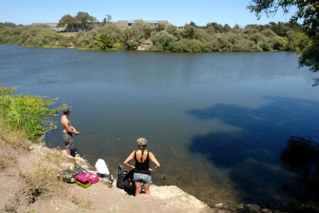 Further along the bank, locals soak in the sun, listen to music and wait patiently for a bite. Largemouth bass, and possibly other varieties of fish, call this place home.