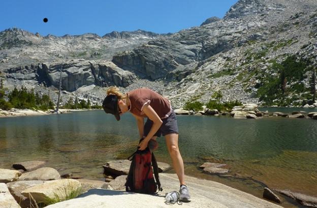 Rummaging in the day pack for bear bait at Twin Lakes. Photo courtesy Brooke Wright.