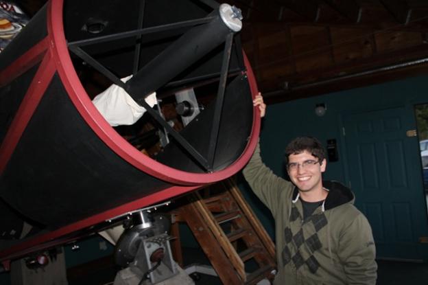 Edward Levin demonstrates the 30-inch Challenger telescope. 