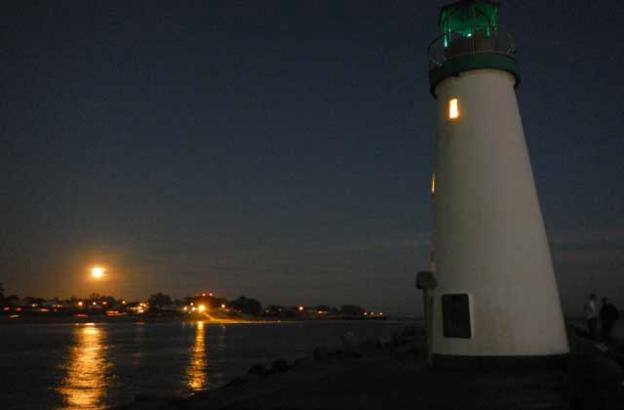 The moon rises over the East Side on Nov. 6, 2014, as seen from the Santa Cruz harbormouth. Ryan Masters photo. 