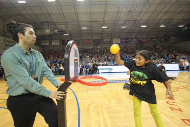 Mia Rodriquez, 10, rocks the rim. Chip Scheuer photo.