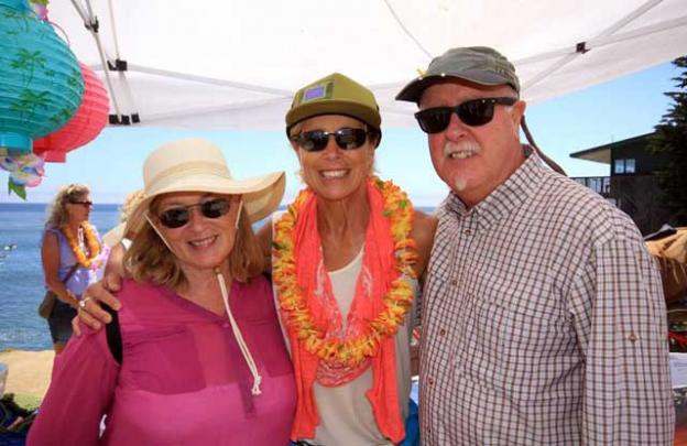 KPIG's Girl in the Curl, Zeuf Hesson (center) with Tim and Sheryl Loomis.