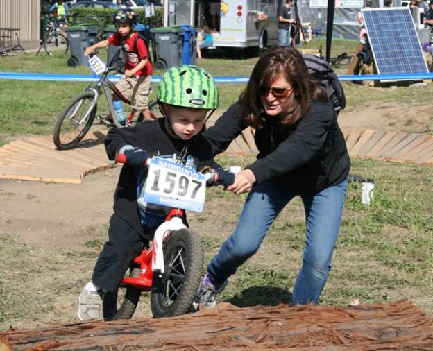 The 2014 Santa Cruz Mountain Bike Festival will attract many parents and kids practicing their skills like this pair pictured here in 2013.