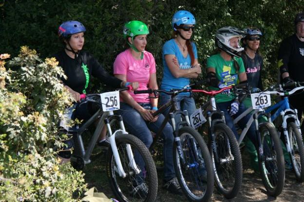 Women dirt jumpers prepare to compete at the debut of the Sugar Showdown, presented by Sweetlines Mountain Bike Coaching in 2013 at the Santa Cruz Mountain Bike Festival.