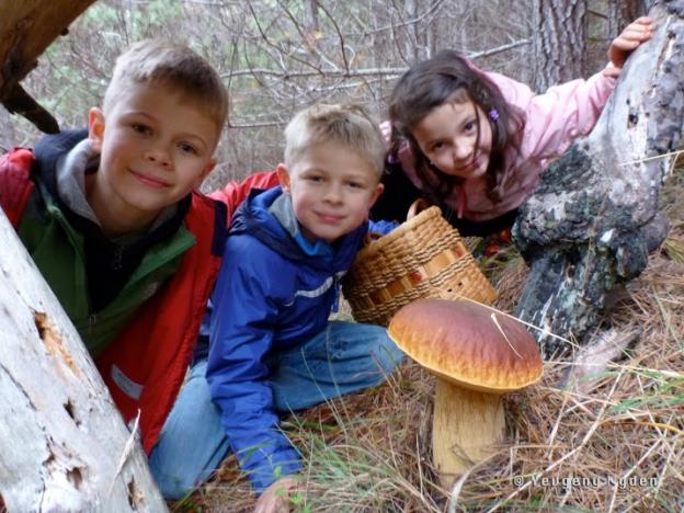 Adorable kids, huge bolete, great shot. Photo by Yevgeny Nyden.