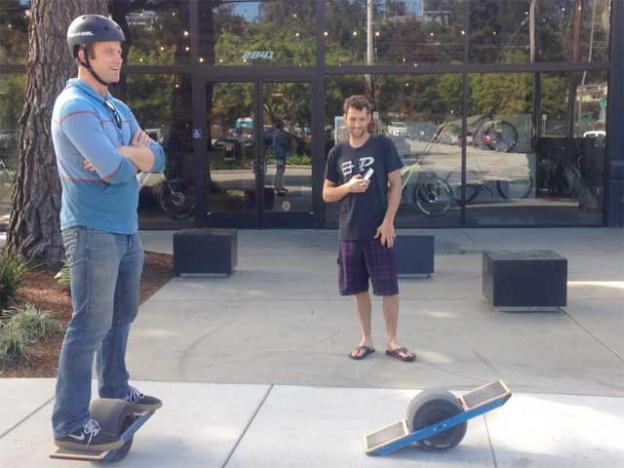 OneWheel creator Kyle Doerksen with a fan outside Future Motion's Santa Cruz headquarters.