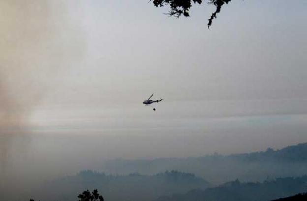 Dec. 17: Another smoky morning helicopter with a very smoky Clear Ridge in the background. We've got two, bigger helo's today!