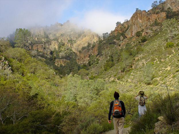 Two hikers look up Condor Gulch Trail at Pinnacles National Park. Photo credit: Miguel Vieira/Creative Commons. 