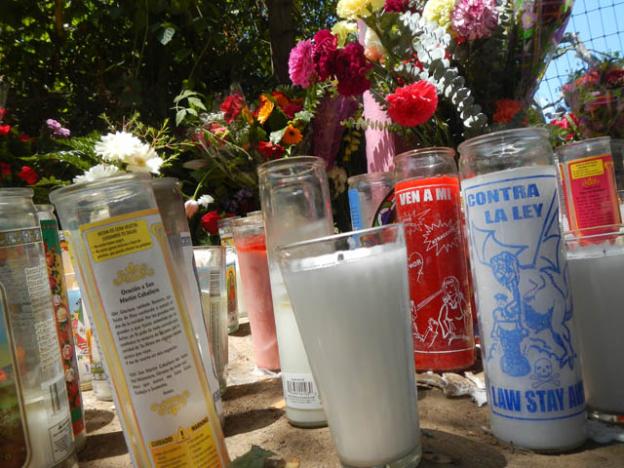 Votive candles beseech the Virgin of Pinto Lake.