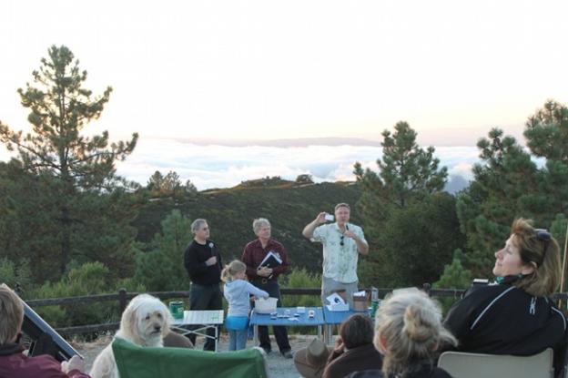 Members of the Fremont Peak Observatory Association raffle telescopes and books to an eager crowd. 