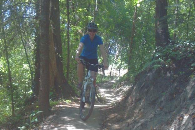 Mountain biker on Emma McCrary Trail in Pogonip in Santa Cruz, California. Hilltromper photo. 
