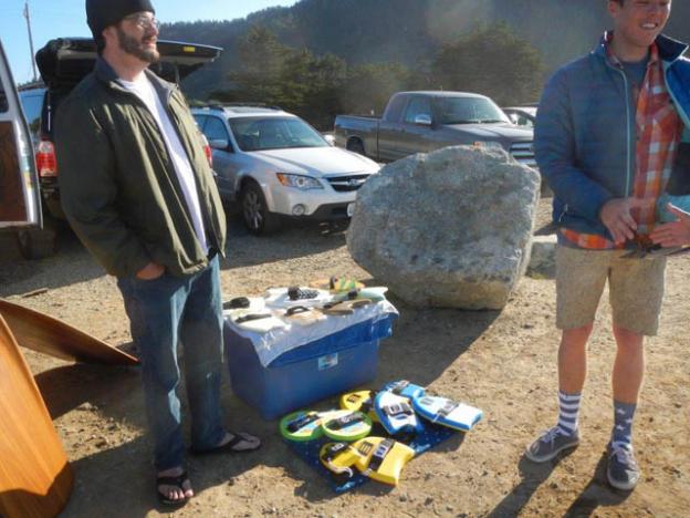 Jason Hackforth (left) of Superbiscuit talks up a bodysurfer.