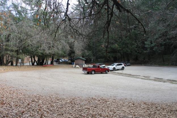 A bare-bones parking area with an iron ranger and a pit toilet are what's there now. Photo by Brendan Bane.