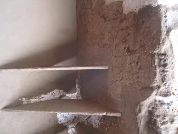 In renovating the cocina, workers were careful not to damage the original corner shelving.