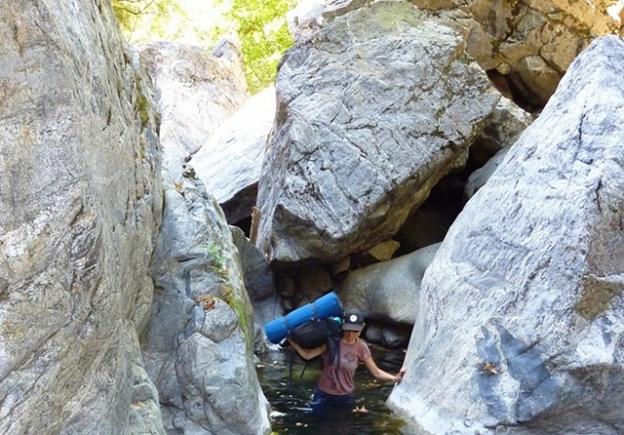 The trip downriver: rock-hopping and slogging. Photo courtesy Brooke Wright.