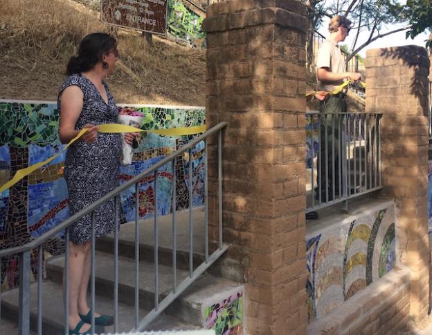 Artist and project adviser Kathleen Crocetti on the new staircase. At right is Chris Spohrer of State Parks.