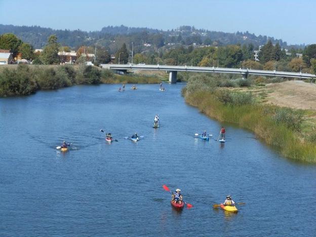 A flotilla of funsters on the Coastal Watershed Council's San Lorenzo River Paddle. Photo by Melissa Foley. 