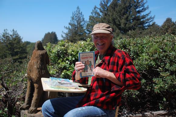 Forest caretaker Jeff Helmer holds up one of the treasures from the park's many rest stops. Photo courtesy Land Trust.