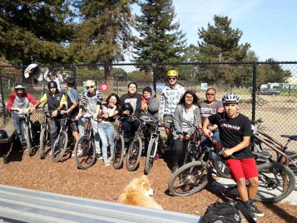 A bunch of smiling PVHS kids at the pump track. There is no pump track in South County. Not yet. Dave Robinson photo.