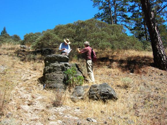 Prof. emeritus Robert Garrison and historian Frank Perry next to the largest remaining "Ruins" chimney. Photo courtesy Hilde Schwartz.