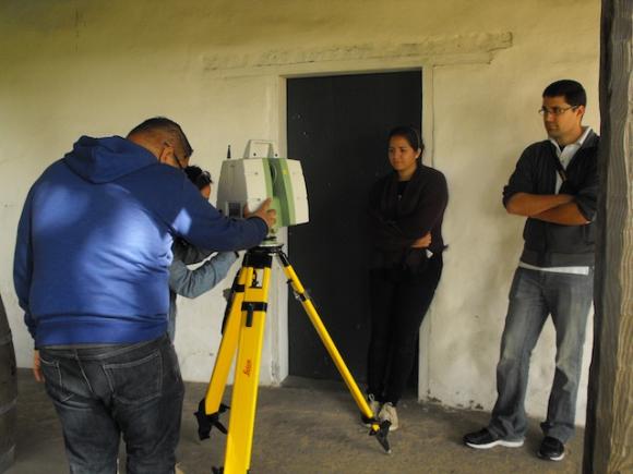 The USF-CyArk team trains the Leica C10 3D laser scanner on the walls of the Mission Adobe during the March 21 scanning session. Hannah Moore photo.